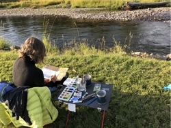 Smaller_carrie_painting_outside_montana_river_preview